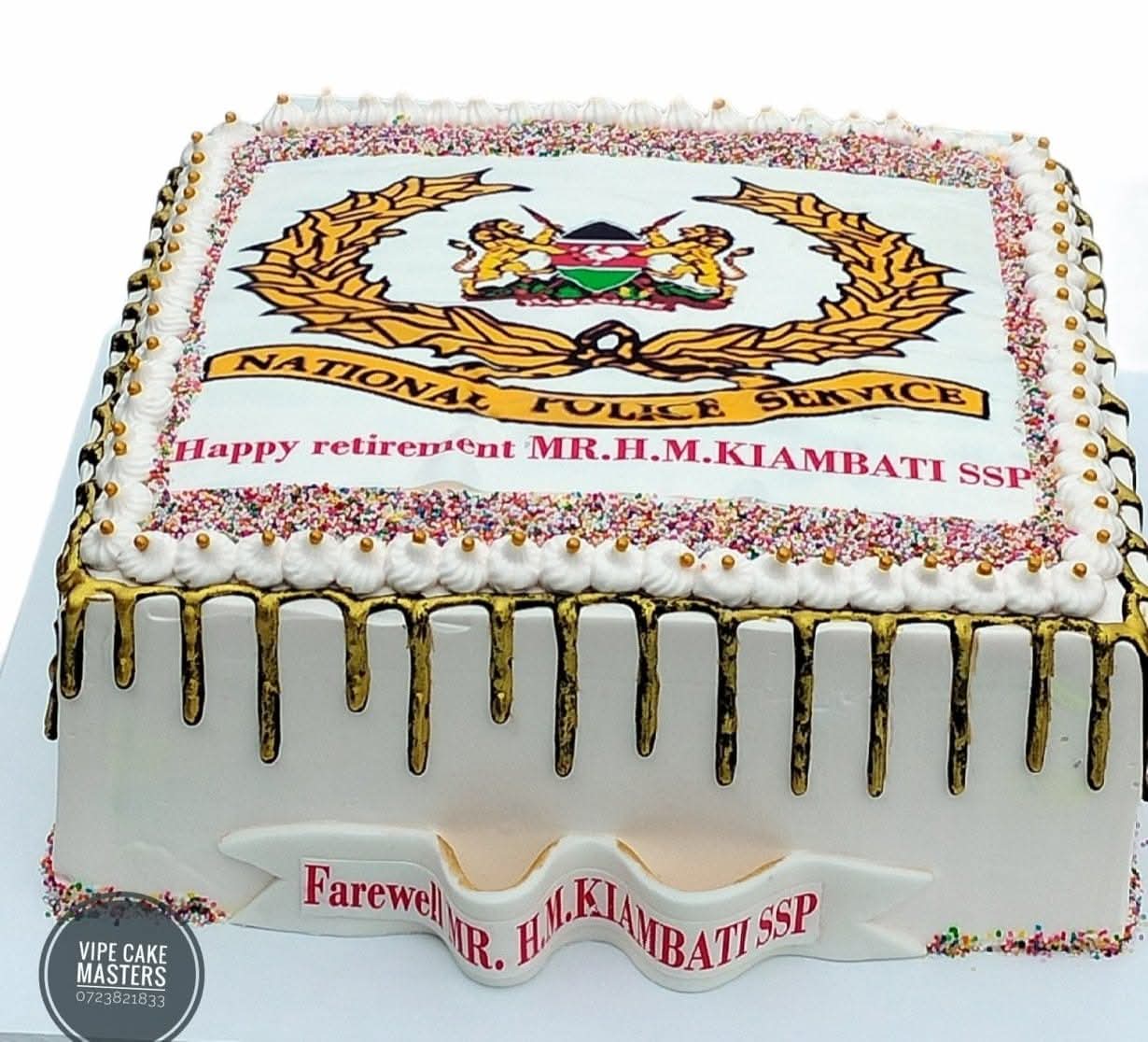 Rectangular retirement cake with National Police Service emblem, gold drip and Happy retirement MR.H.M.KIAMBATI SSP message