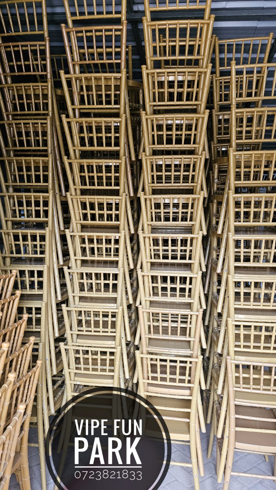 Stacks of gold event chairs in storage at Vipe Fun Park